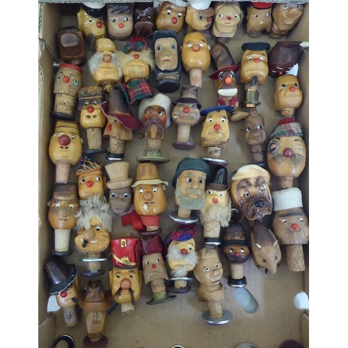 243 - Novelty wooden bottle stoppers, shaped as various characters: to include a chef  4.5