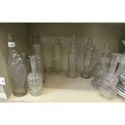 248 - Glass bottles and decanters  various shapes & sizes: to include an example in the form of a... 