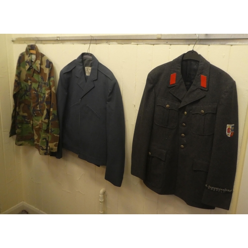 262 - Military and service uniforms: to include a German overcoat(Please Note: this lot is subject to the ... 