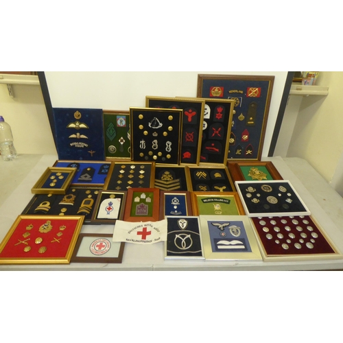 268 - Military badges and buttons, mostly mounted on boards(Please Note: this lot is subject to the statem... 