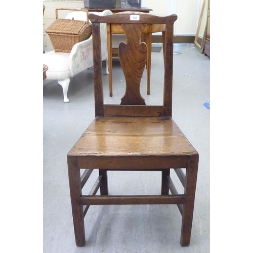 283 - A George III ash and oak framed hall chair with a solid seat, raised on square, tapered legs