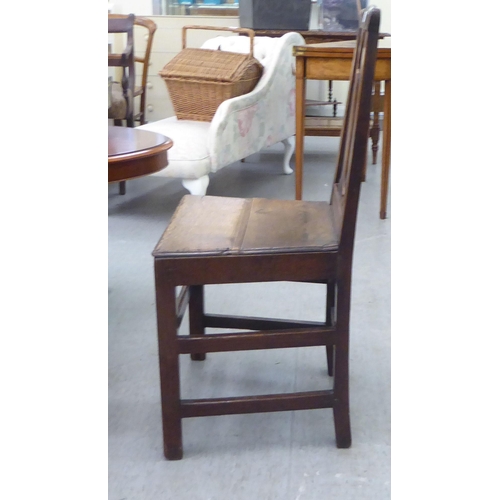 283 - A George III ash and oak framed hall chair with a solid seat, raised on square, tapered legs