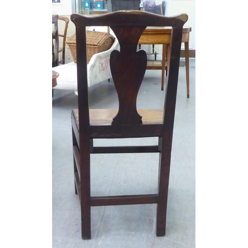 283 - A George III ash and oak framed hall chair with a solid seat, raised on square, tapered legs