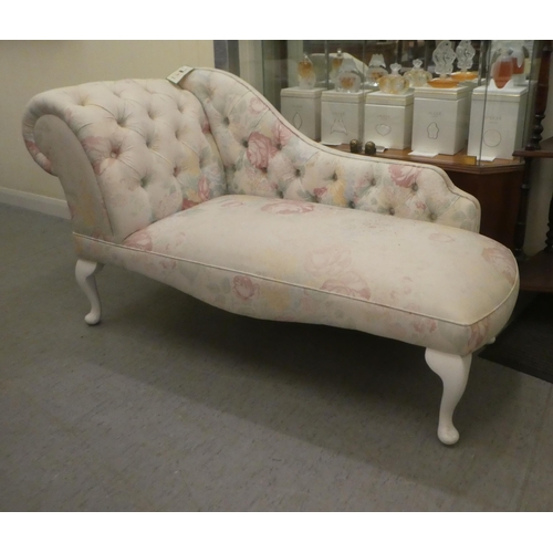 287 - A modern Edwardian style nursery size, chaise longue, decorated in floral patterned, white and paste... 