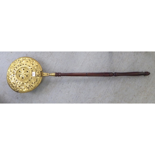 308 - A late 18thC brass bed warming pan, on a turned fruitwood handle  50