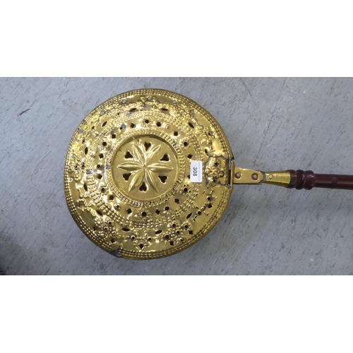 308 - A late 18thC brass bed warming pan, on a turned fruitwood handle  50