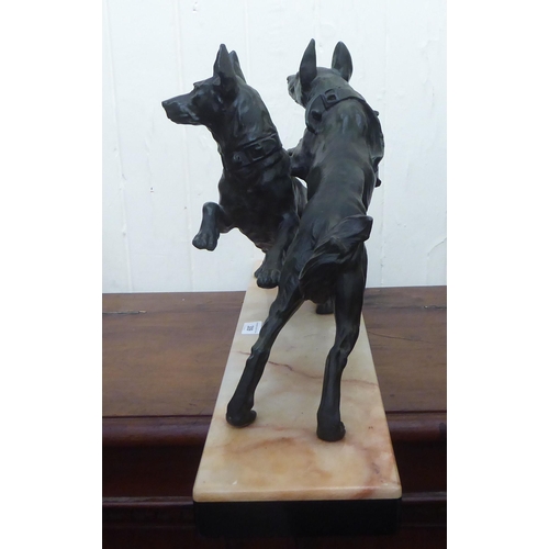 309 - A 1930s Art Deco patinated spelter ornament, two playful dogs, on a marble plinth  14