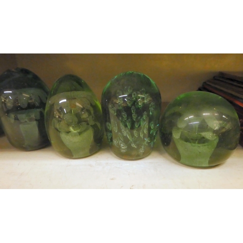 311 - Five late Victorian green glass dumps with bubbled decoration  largest 4