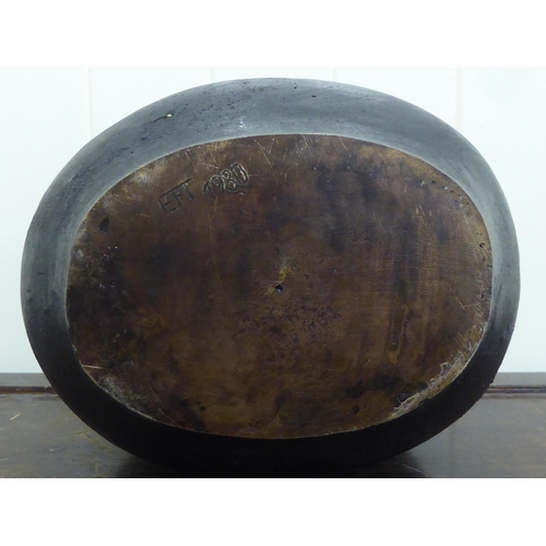 312 - A cast bronze and bulbous base  inscribed EFT 1980  10