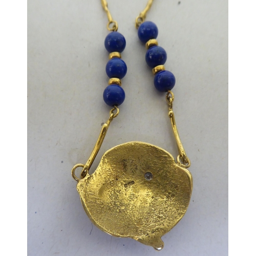 316 - An 18ct gold organic design pendant necklace, set with lapis lazuli beads and a diamond