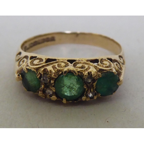 319 - A 9ct gold diamond and emerald ring