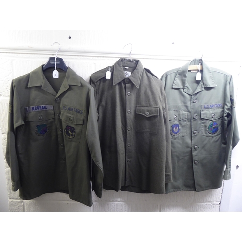 32 - Six British and US Army overalls and fatigues: to include shirts(Please Note: this lot is subject to... 