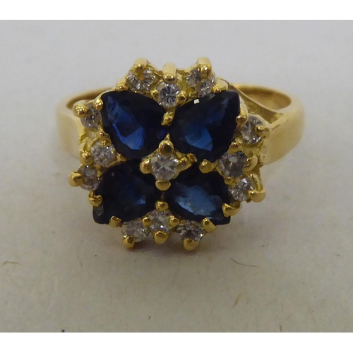 321 - An 18ct gold, diamond and sapphire cluster ring