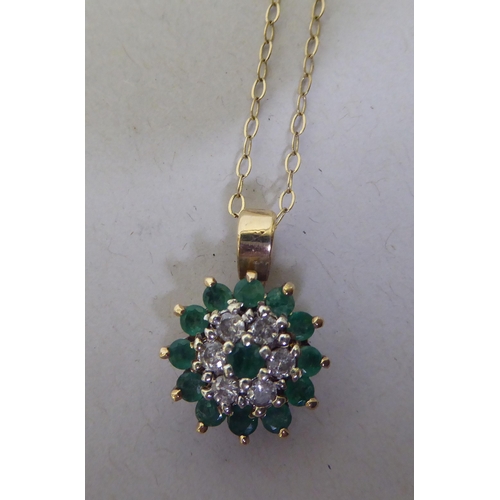 337 - A 9ct gold emerald and diamond pendant necklace