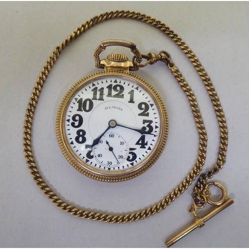 341 - An Illinois gold plated pocket watch, the movement faced by an Arabic dial with a gold plated watch ... 