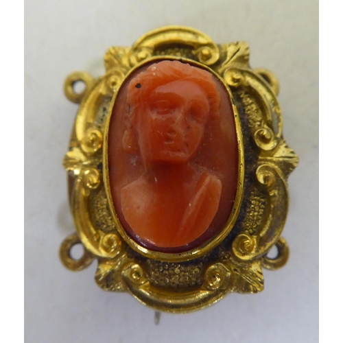 344 - A late Victorian yellow metal coral cameo brooch