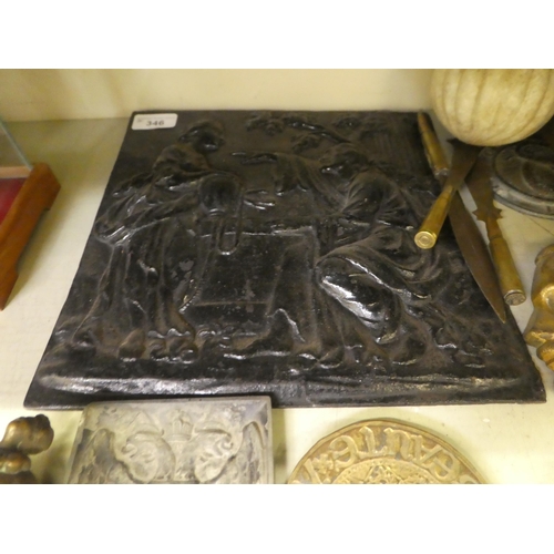 346 - A mixed lot: to include a black painted, cast iron plaque, depicting two figures in a garden  1... 