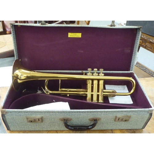 347 - A Cambridge brass finished trumpet  cased