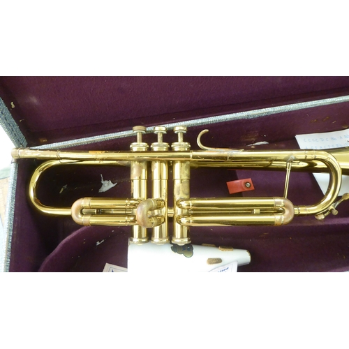 347 - A Cambridge brass finished trumpet  cased