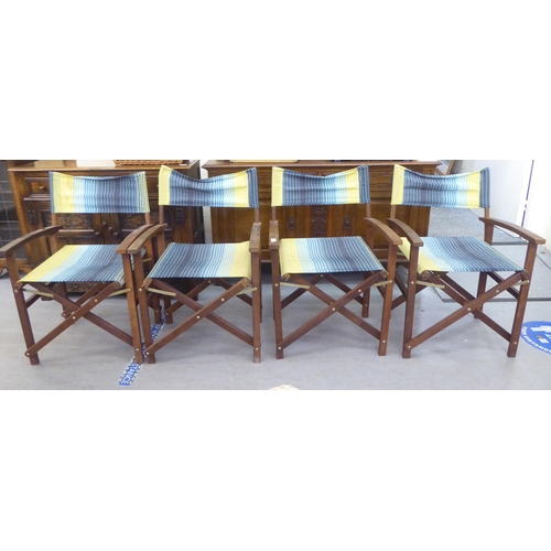 348 - A set of four John Lewis teak framed, folding directors chairs with fabric backs and seats