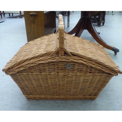 352 - A modern wicker picnic basket, containing two place settings of cutlery and flatware