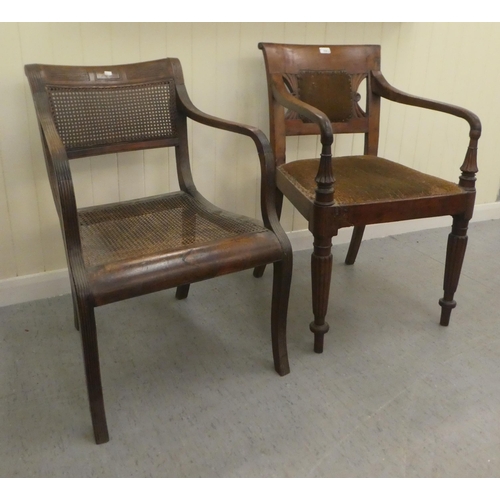 354 - A Regency mahogany framed dining chair with a bar back and swept open arms, raised on turned, reeded... 