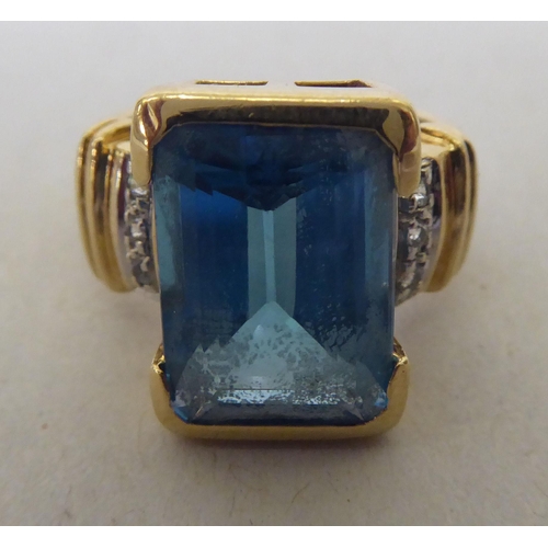 356 - A 9ct gold, blue topaz and diamond ring