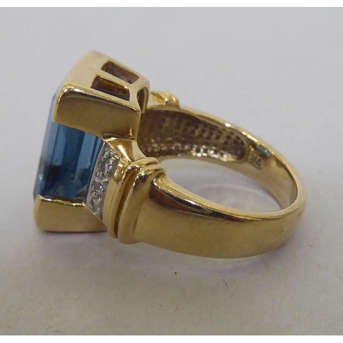 356 - A 9ct gold, blue topaz and diamond ring