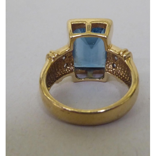 356 - A 9ct gold, blue topaz and diamond ring