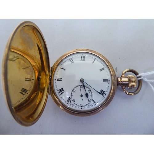 359 - An early 20thC gold plated hunter pocket watch, faced by a Roman dial