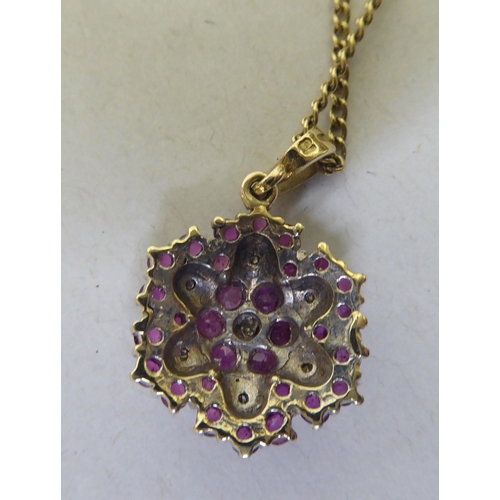 364 - A 9ct gold ruby and diamond pendant necklace