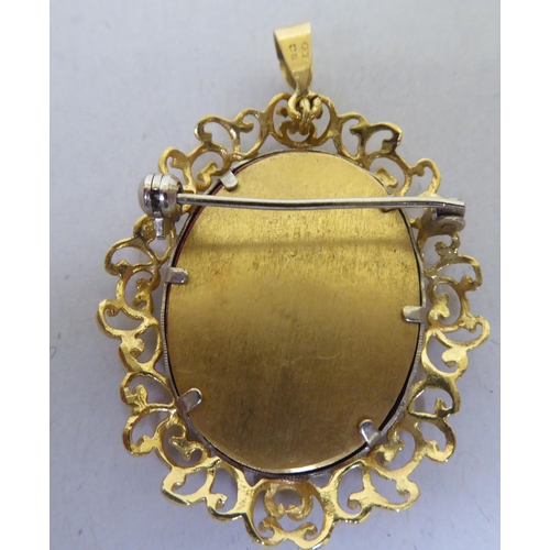 366 - A 9ct gold filigree pendant, set with a painted portrait of a lady