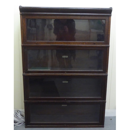 375 - An oak Globe Wernicke four section, glazed front bookcase  49.5