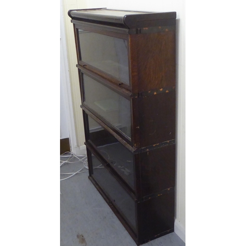 375 - An oak Globe Wernicke four section, glazed front bookcase  49.5