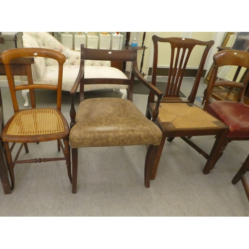 376 - Chairs: to include a late Victorian oak framed bar back dining chair, raised on turned legs