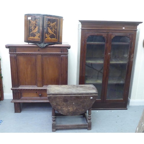 386 - Small furniture: to include a late 18thC marquetry hanging corner cupboard with two doors, decorated... 