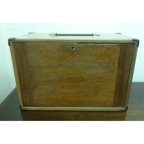 389 - A mid 20thC oak engineer's tool chest, the removeable front panel enclosing seven drawers  11