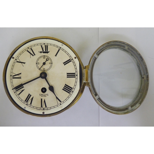 40 - A Smiths Astral brass cased bulkhead timepiece, faced by a Roman dial  8