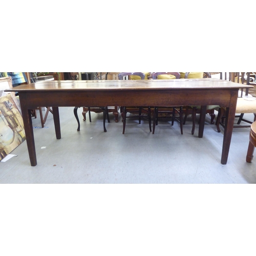 66 - An 18thC farmhouse style oak refectory table, the planked top over a single drawer, raised on square... 