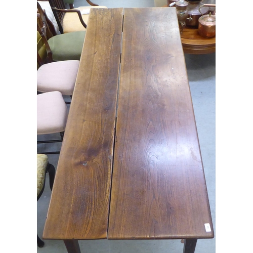 66 - An 18thC farmhouse style oak refectory table, the planked top over a single drawer, raised on square... 