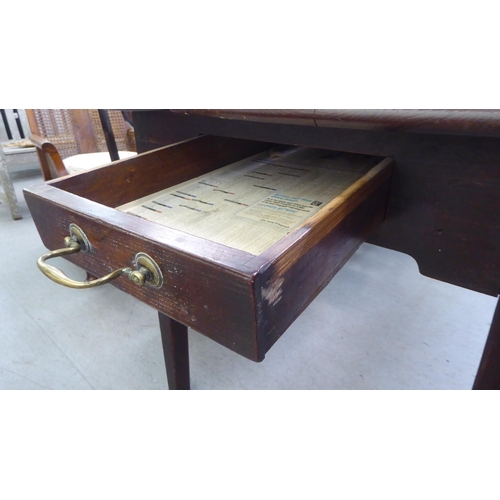 66 - An 18thC farmhouse style oak refectory table, the planked top over a single drawer, raised on square... 