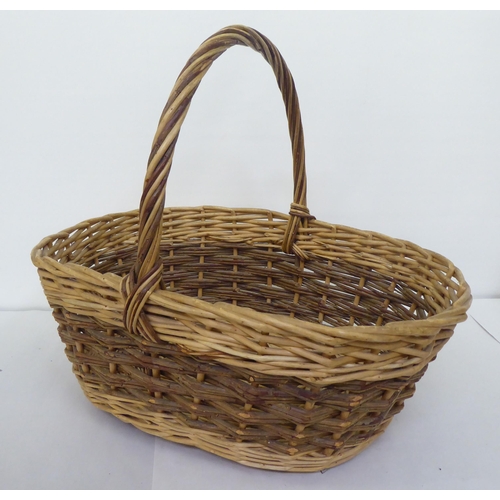 71 - Four woven cane baskets  largest 17