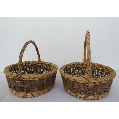 71 - Four woven cane baskets  largest 17