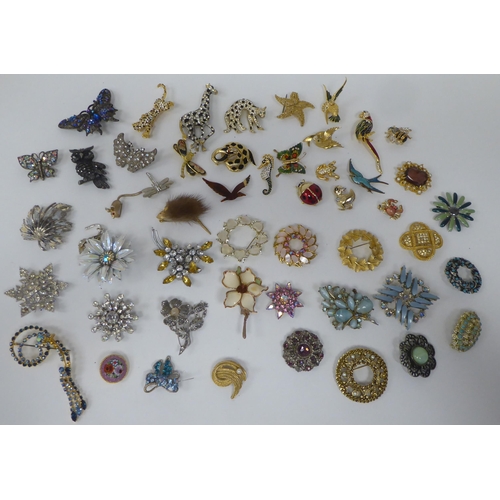 88 - Costume jewellery, mainly brooches, variously set with coloured stones and glass ornament 