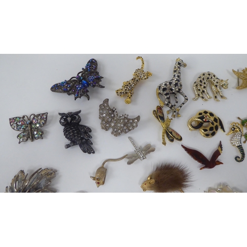 88 - Costume jewellery, mainly brooches, variously set with coloured stones and glass ornament 