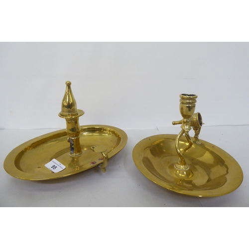 95 - Metalware: to include a late Victorian brass chamberstick with a tray base  10