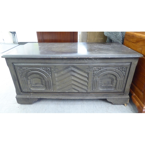 191 - A modern, black stained mixed veneer chest, decorated with carved architectural designs, 19''h, 40''... 