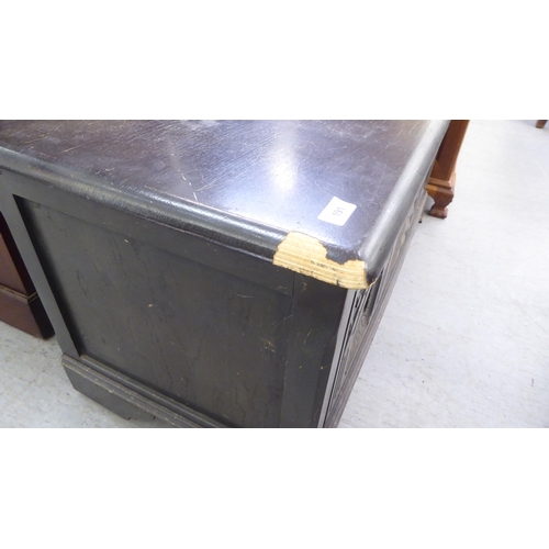 191 - A modern, black stained mixed veneer chest, decorated with carved architectural designs, 19''h, 40''... 