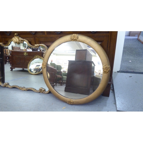 203 - Mirrors: to include an early 20thC example, in a gilt gesso frame with rosette ornament