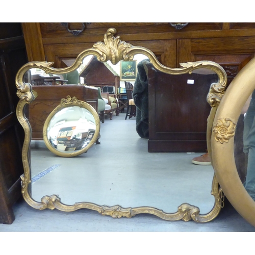 203 - Mirrors: to include an early 20thC example, in a gilt gesso frame with rosette ornament